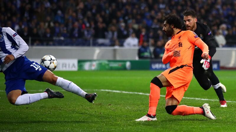 Mohamed Salah slots Liverpool’s second against Porto. Photograph: Julian Finney/Getty