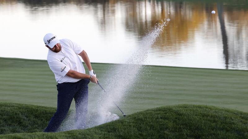 Shane Lowry splashes out of a bunker  on the 18th hole during the first round of The Players Championship at TPC Sawgrass in Ponte Vedra Beach, Florida. Photograph: Erik S Lesser/EPA