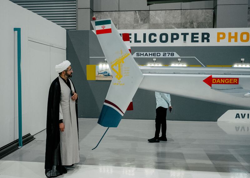 A cleric tours the National Aerospace Park in Tehran. Photograph: Nanna Heitmann/New York Times
                      