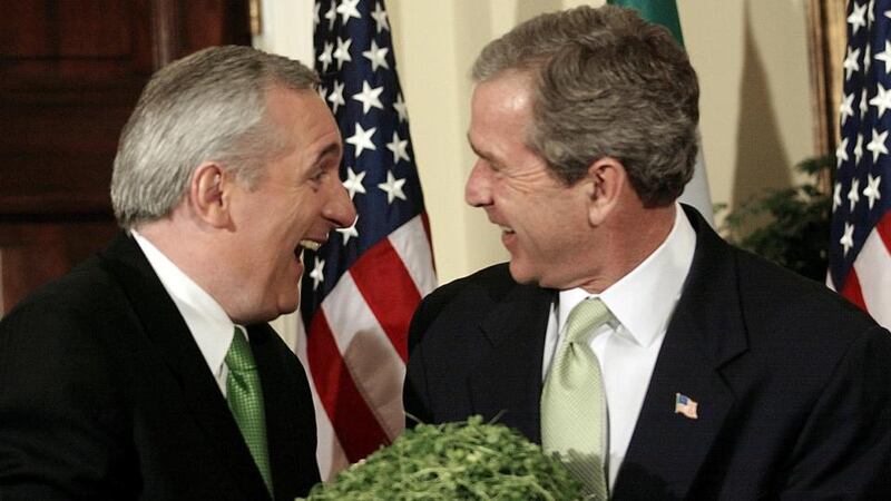 Former taoiseach Bertie Ahern shares a joke with then US president   George W Bush   in  the White House in 2002. Photograph: Stephen Jaffe/AFP/Getty Images