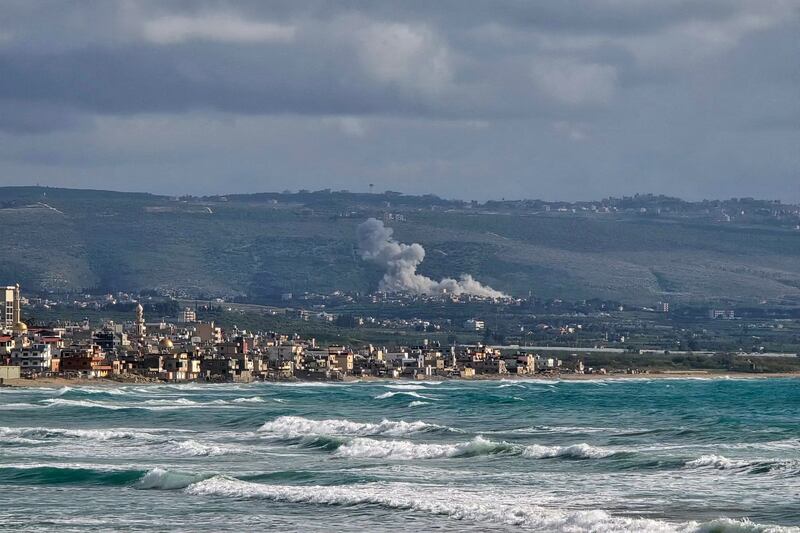 This photograph taken from the southern Lebanese area of Tyre shows smoke rising from the site of an Israeli strike in Hanniyeh village of Lebanon, on April 5, 2026. (Photo by Kawnat HAJU / AFP via Getty Images)