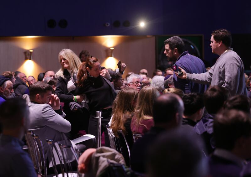 UCD lecturer Lior Tibet being removed by security from the Mansion House event. Photograph: Alan Betson