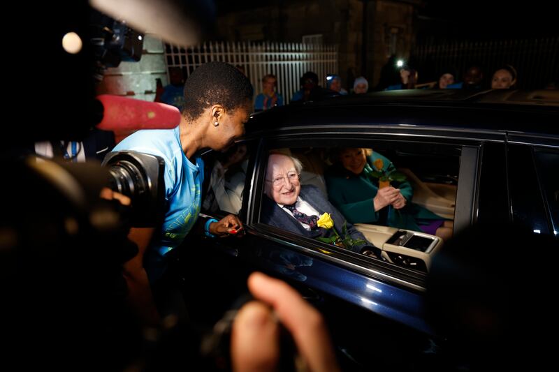 Sanctuary Runners, a solidarity-through-sport movement, provided a final guard of honour for President Michael D Higgins when he and Sabina Higgins left Áras an Uachtaráin for the final time on Monday night. Birthday girl Monica Pumpkin presented flowers during the guard of honour. Photograph Nick Bradsha/The Irish Times