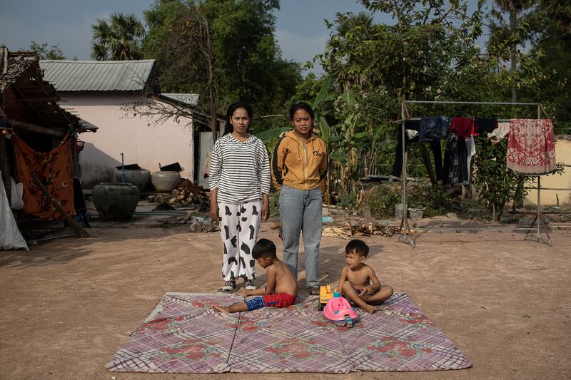 Ry Ly, left, and Vin Win, who were both arrested while pregnant as surrogates and forced by the courts to raise the boys, pictured, they birthed. Photograph: Nadia Shira Cohen/The New York Times