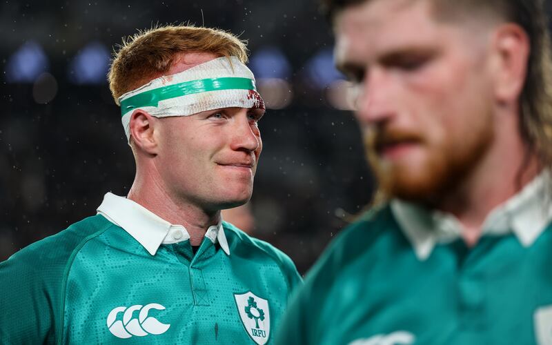 Ireland's Ciaran Frawley and Joe McCarthy dejected after defeat to New Zealand. Photograph: INPHO/Ben Brady