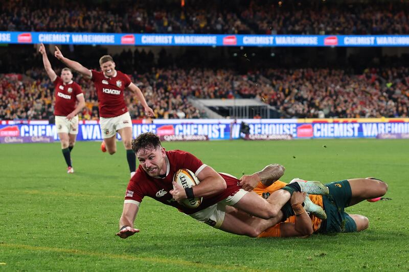 Hugo Keenan's scores the try that clinched a series victory for the Lions in Australia. Photograph: Cameron Spencer/Getty Images