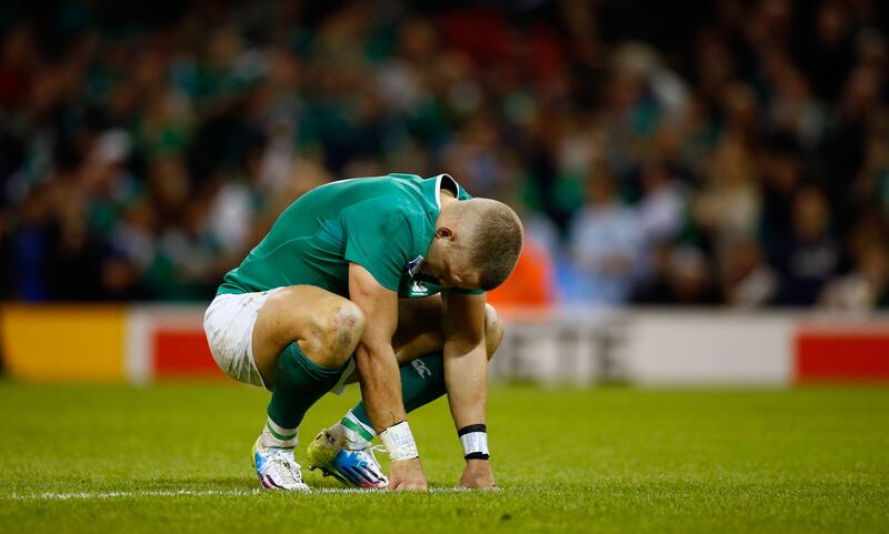 A dejected Ian Madigan reacts after Ireland lost to Argentina in the 2015 World Cup quarter-final. Photograph: Stu Forster/Getty Images