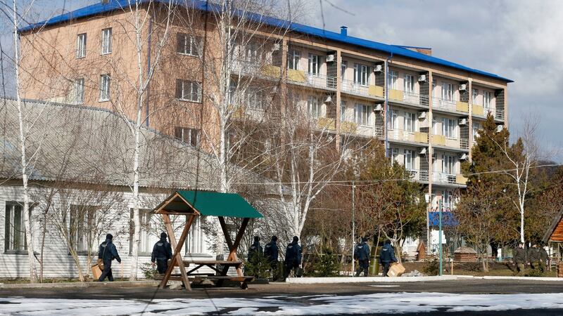 Ukrainian National Guards soldiers patrol an area at the sanitarium where the evacuees from the Chinese city of Wuhan are to be quarantined, in Novi Sanzhary village on Friday. Photograph:  Efrem Lukatsky/PA