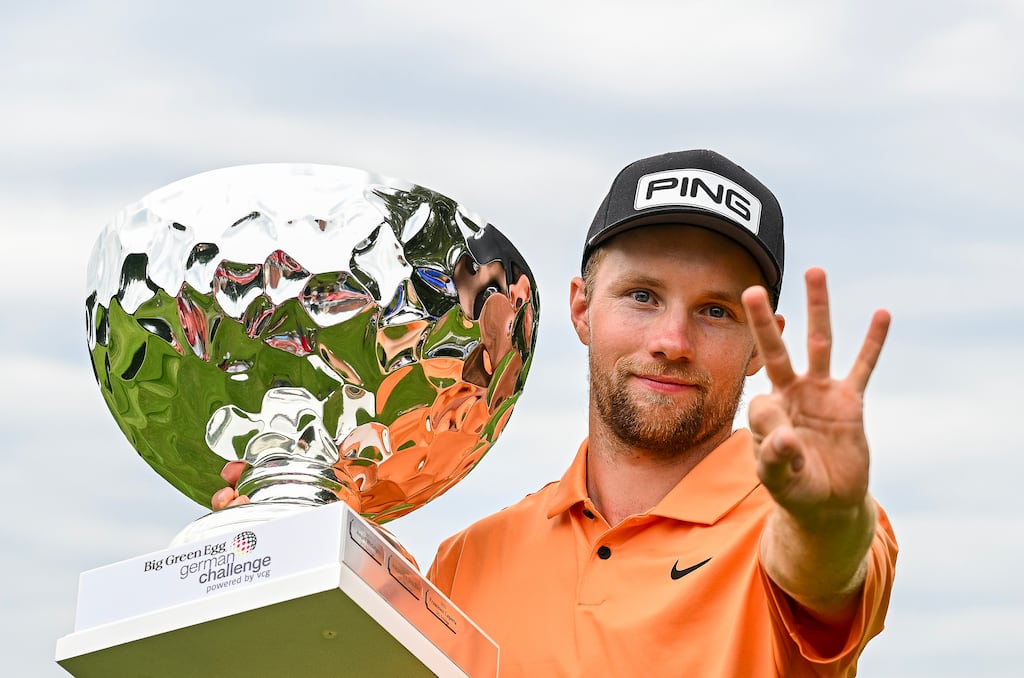 Rasmus Neergaard-Petersen celebrates his third win of the year on the Challenge Tour in the Big Green Egg German Challenge at Wittelsbacher GC in Neuburg an der Donau, Germany. Photograph: Octavio Passos/Getty Images
