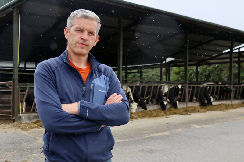 Dairy farmer William Cassidy with his cattle
