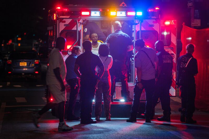 An ambulance outside of the bar in Brooklyn where the shooting took place. Photograph: Dakota Santiago/The New York Times