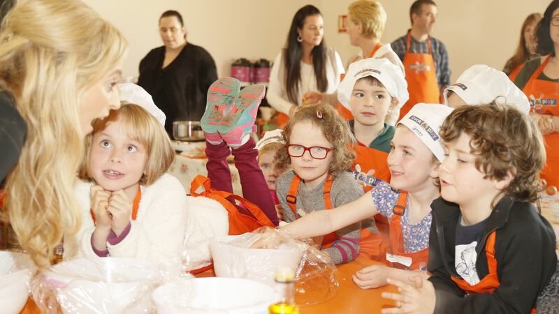 Chef Aisling Larkin with Eve Cullen and other children at the Ben’s Beginner’s Cook and Play session at Airfield, Co Dublin. Photograph: Kieran Harnett