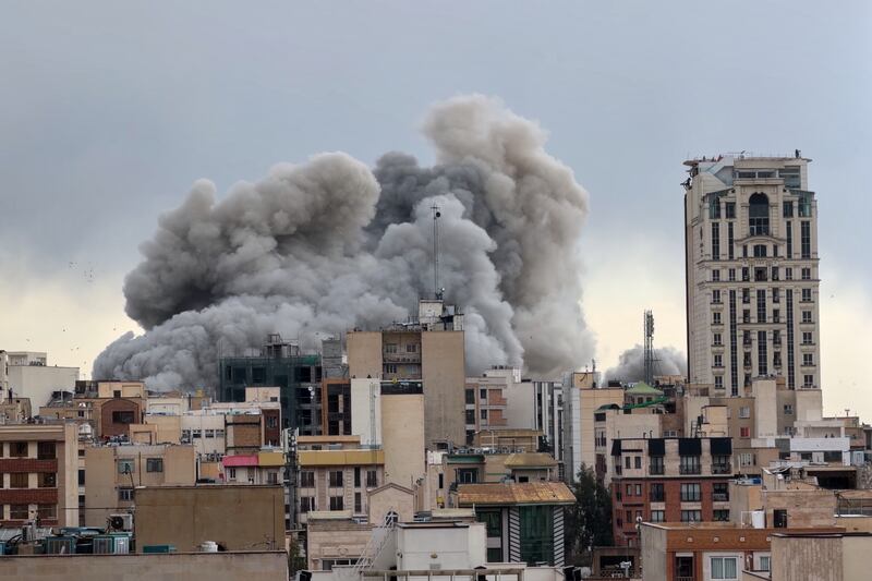 A plume of smoke rises after a strike in Tehran, Iran, on Monday. Photograph: Mohsen Ganji/AP