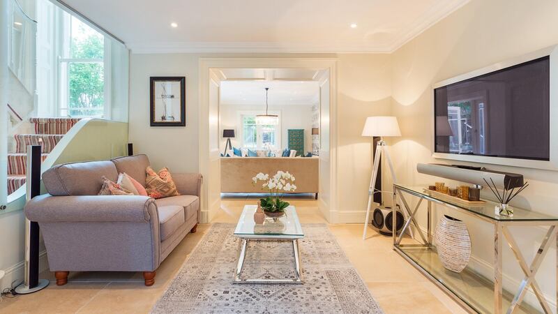 The smaller of the two livingrooms in the basement is called the cinema room and has a large-screen TV