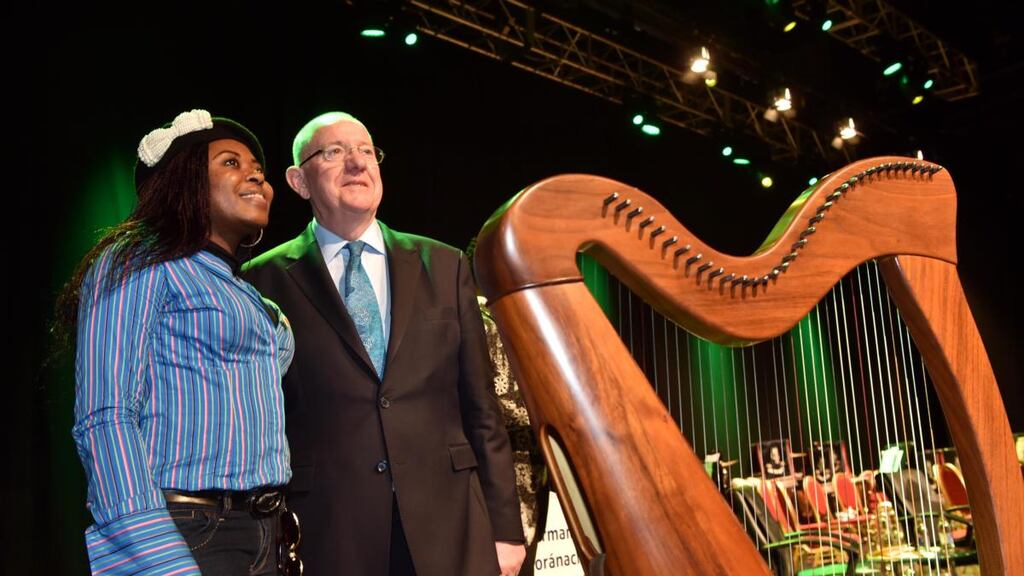 Mabel Chah from Cameroon  with Minister for Justice Charlie Flanagan after she received her Irish citizenship at the Citizenship Ceremony in the INEC, Killarney. Photograph: Don MacMonagle