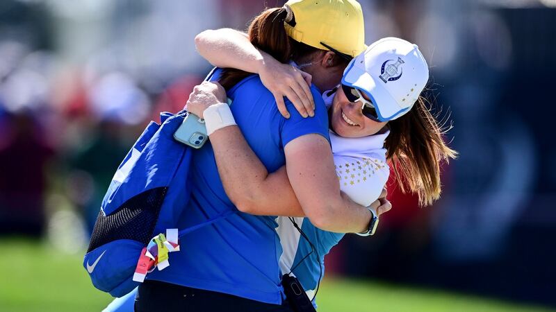 Europe’s Leona Maguire celebrates with her sister Lisa after defeating United States’ Jennifer Kupcho on the 15th hole  at the Solheim Cup  in Toledo, Ohio. Photograph: David Dermer/AP