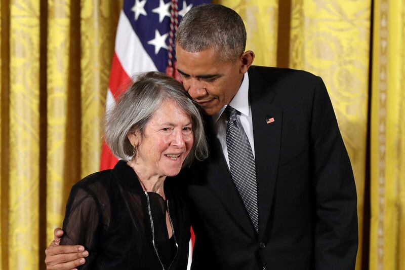 Former US president Barack Obama embraces poet Louise Glück before awarding her the 2015 National Humanities Medal at the White House in 2016. Photograph: Carolyn Kaster/AP/PA