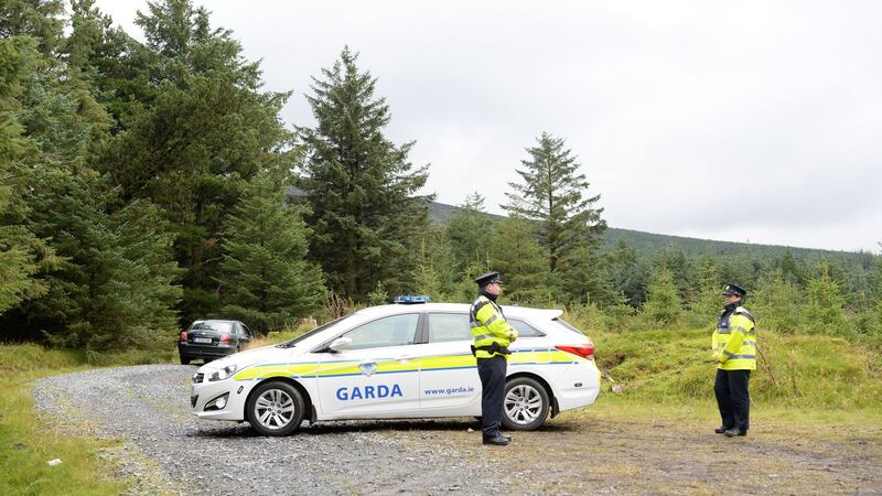 Gardaí near scene where Michael McCoy’s body was found in the Dublin mountains over the weekend. Photograph: Dara Mac Dónaill/The Irish Times