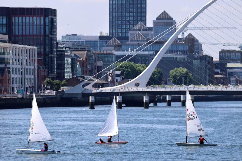 Members of Poolbeg Sailing Club's summer camp on the River Liffey beside the Samuel Beckett Bridge in Dublin. Photograph: Dara Mac Dónaill/The Irish Times