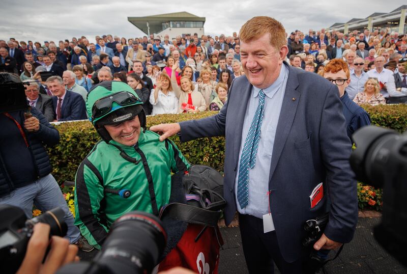 Jordan Gainford celebrates with trainer John ‘Shark’ Hanlon after Hewick's victory in The Tote Galway Plate with Hewick. Photograph:  James Crombie/Inpho