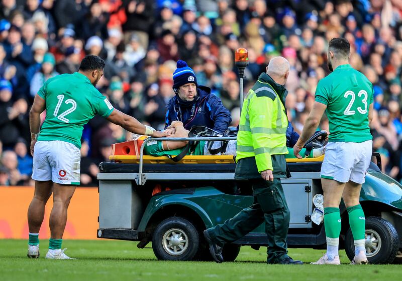 Ireland’s Bundee Aki and Robbie Henshaw check on Garry Ringrose as he goes off injured at Murrayfield. Photograph: Dan Sheridan/Inpho 