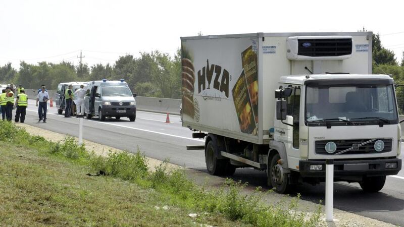 The  lorry in which refugees were found dead stands on autobahn A4 between Parndorf and Neusiedl in Austria on Thursday. Photograph: EPA