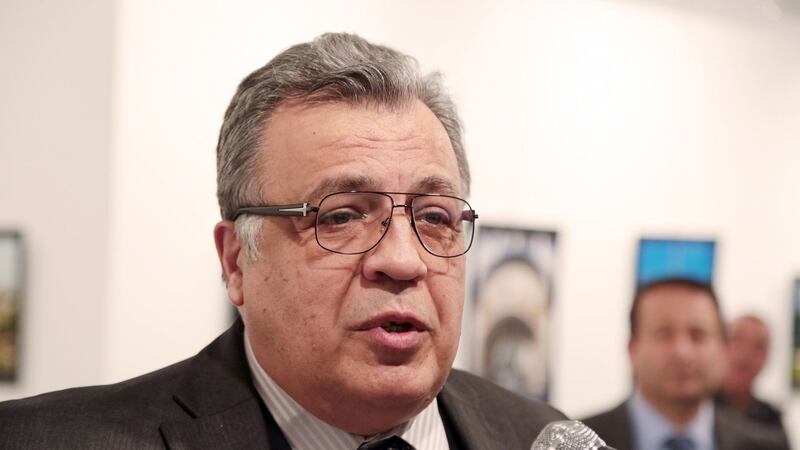 Andrei Karlov, the Russian Ambassador to Turkey, speaks at a photo exhibition in Ankara on Monday moments before a gunman opened fire on him. Photograph: Burhan Ozbilici/AP