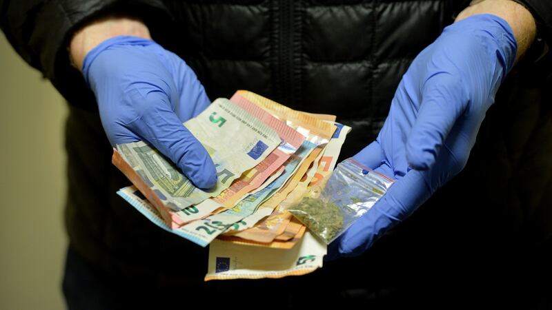 Gardaí display cash and drugs seized after a search. Photograph: Alan Betson