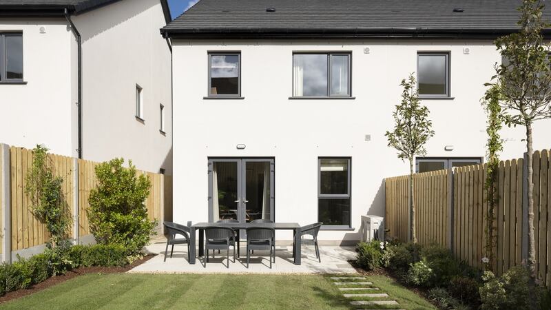The rear garden features a patio area