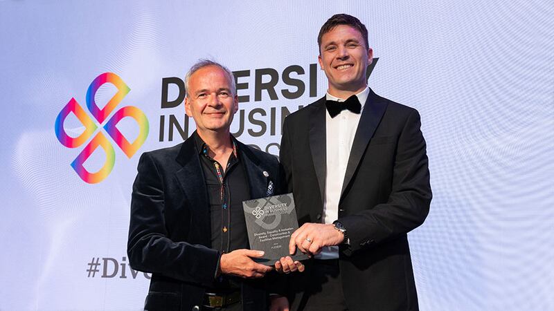 Mark Fenton, awards judge, presents the diversity, equality & inclusion award - construction and facilities management to Anthony Walsh, Flexéir
