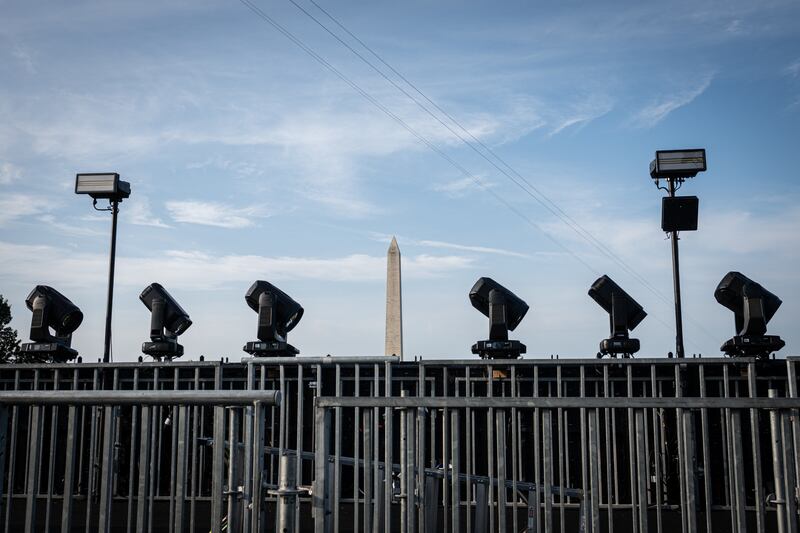 Floodlights and security barriers around the UFC’s octagon cage on the grounds of the White House. Photograph: Haiyun Jiang/The New York Times
                      