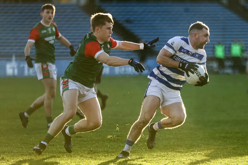 Castlehaven's Michael Hurley gathers the ball with St Brigids' Brian Derwin in close attendance on the sunny side of the pitch in Semple Stadium. Photograph: Ben Brady/Inpho 