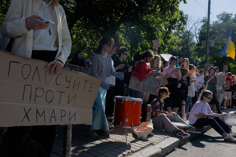 A protester holds a placard reading "Vote against Khmara" during a demonstration before the start of a parliamentary session on the appointment of Ukraine's new defence minister in Kyiv on Wednesday. Photograph: Tetiana Dzhafarova/ AFP via Getty Images