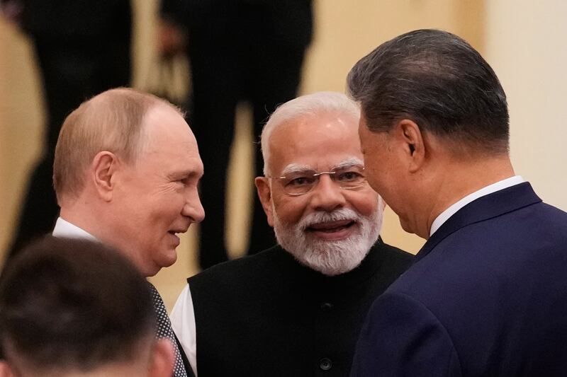 Russian president Vladimir Putin, Indian prime minister Narendra Modi and Chinese president Xi Jinping talk ahead of the Shanghai Co-operation Organisation in Tianjin. Photograph: Suo Takekuma/AP