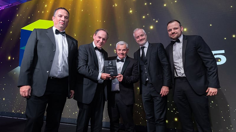 Ray Bryne, group sales and marketing director at Stacked, presents the fit out project of the year - retail award to Johnston Fitout team