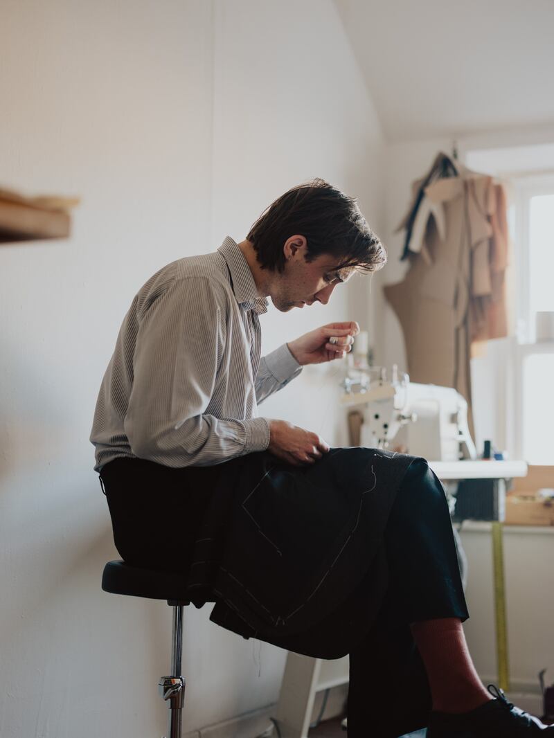 Tailor Fionn O Dubhghaill at work. Photograph: Ellius Grace