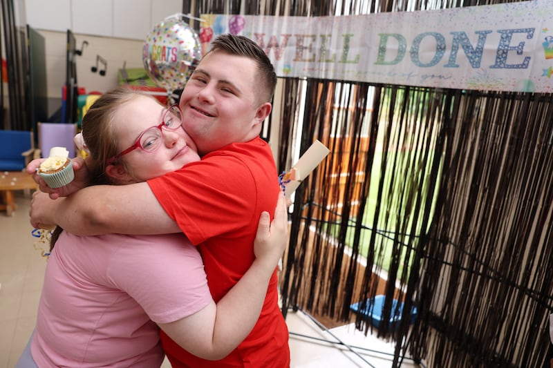 Kendra Hopkins (18) hugs her friend Leon McKenny (18) at St Catherine's special school in Co Wicklow, Ireland. Photograph: Clodagh Kilcoyne/The Irish Times