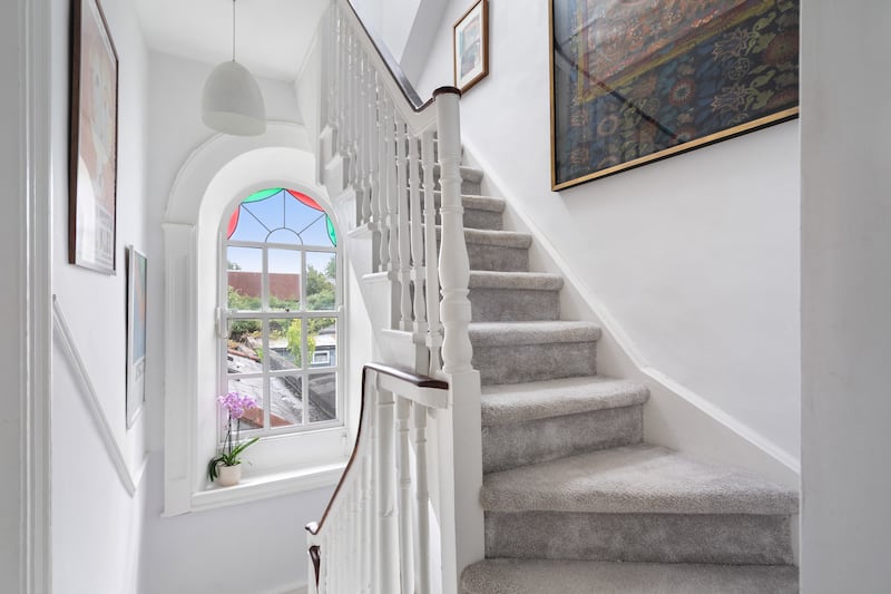 Arched window floods the stairs with light