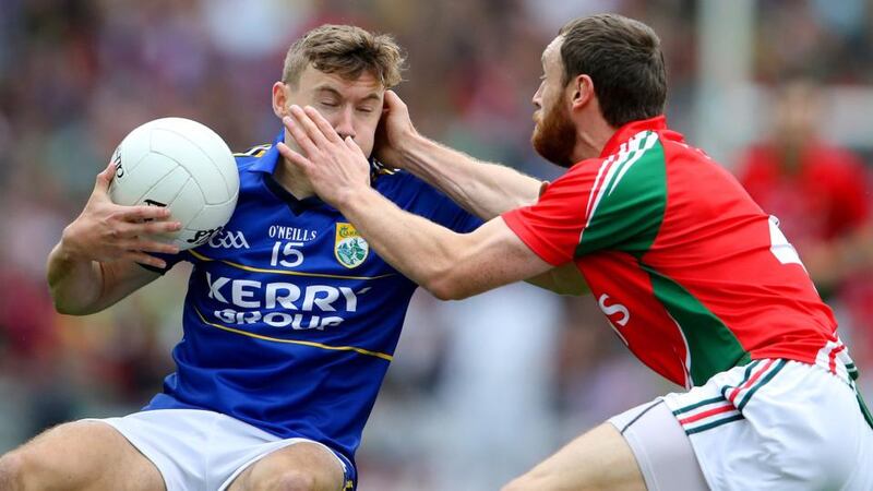 Kerry’s James O’Donoghue at close quarters with Mayo’s Keith Higgins at Croke Park. Photograph: Cathal Noonan / Inpho