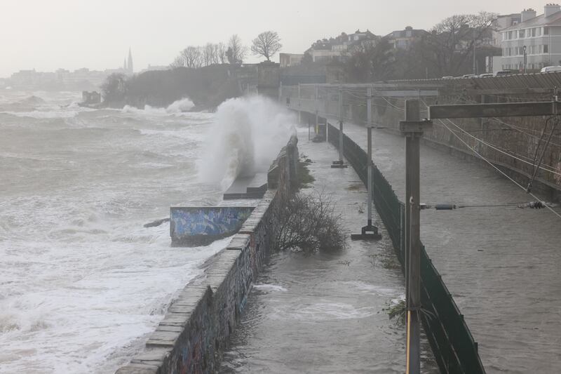 Waves crash over the Dart tracks just south of Blackrock station. Photograph: Dara Mac Donaill