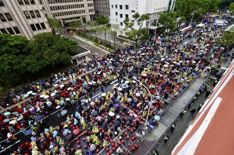 Demonstrators gather during a protest against three bills proposed by Taiwan's opposition parties, outside the Parliament building in Taipei, Taiwan. Photograph: Richie B Tongo/EPA-EFE