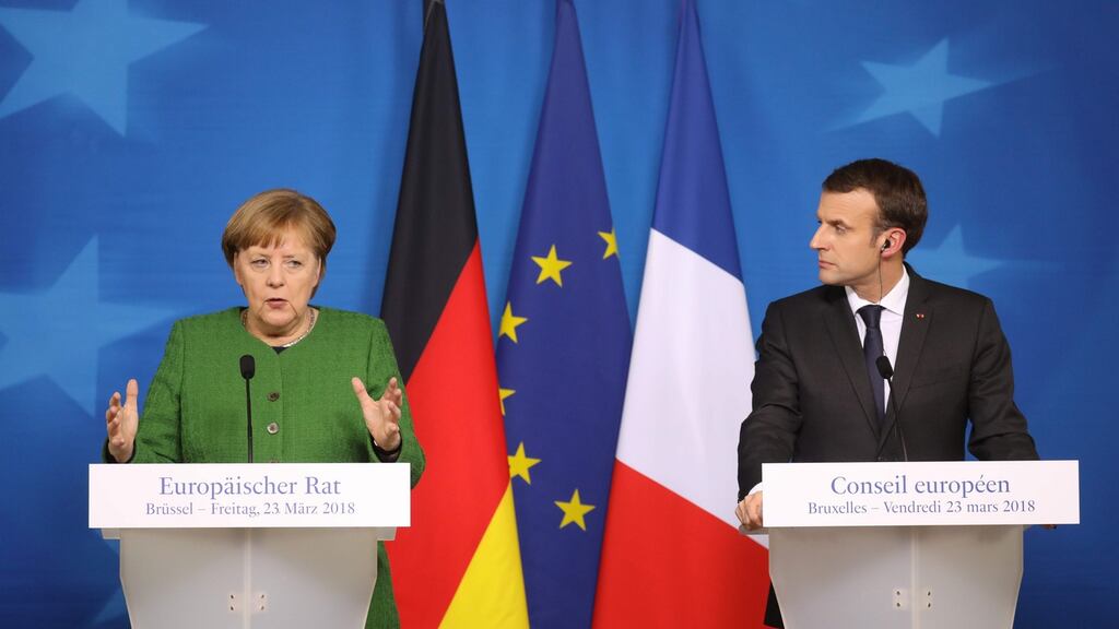 Germany’s chancellor Angela Merkel with French president Emmanuel Macron: expressed solidarity with Britain days after the attack. Photograph: AFP/Getty Images