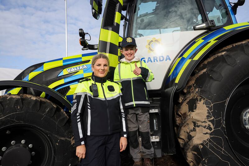 Adam Delaney (9), with Sgt Maureen Neary on the Garda tractor. Photograph: Dan Dennison