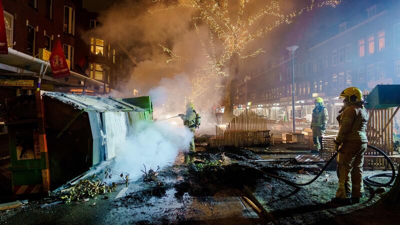 Firefighters work to extinguish a fire on the Groene Hilledijk in Rotterdam on  Monday. Photograph: Marco de Swart/ANP/AFP via Getty Images