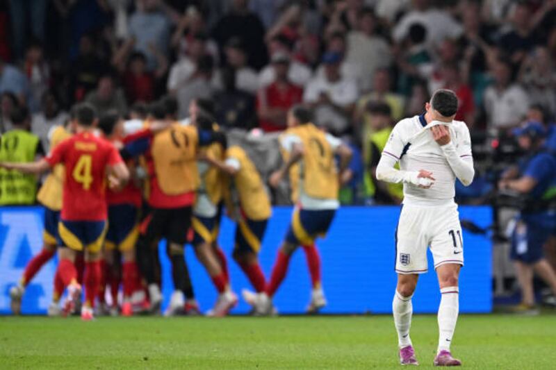 England's midfielder #11 Phil Foden reacts after Spain's midfielder #21 Mikel Oyarzabal (unseen) scored his team's second goal during the UEFA Euro 2024 final football match between Spain and England at the Olympiastadion in Berlin on July 14, 2024. (Photo by Kirill KUDRYAVTSEV / AFP) (Photo by KIRILL KUDRYAVTSEV/AFP via Getty Images)