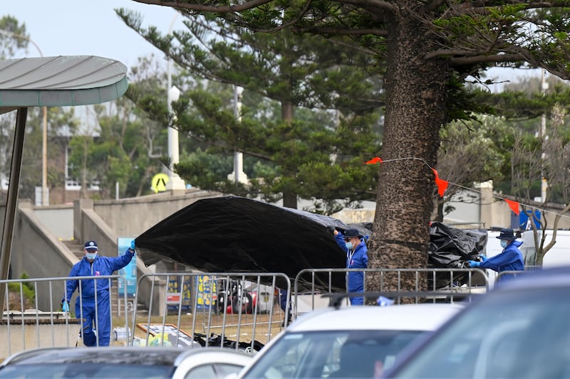 Police and forensic experts inspect the scene of a shooting at Bondi Beach in Sydney, Australia. Photograph: Izhar Khan/Getty Images