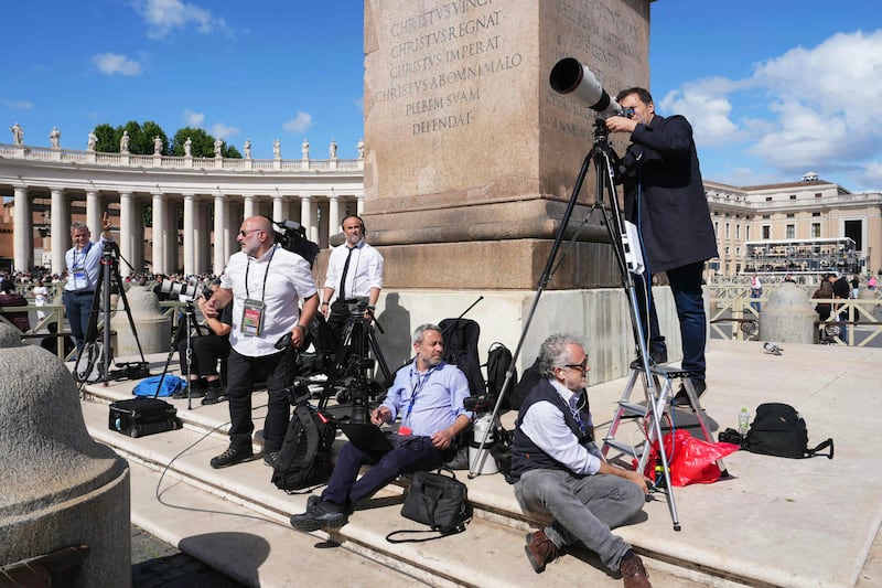 Members of the press waiting for Papa on St Peter's Square this afternoon. Photo: Dimitar DILKOFF / AFP