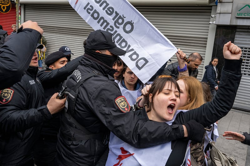 Turkish police officers detain protesters attempting to reach Taksim Square to celebrate International Workers' Day on Thursday. Photograph: Umit Turhan/EPA