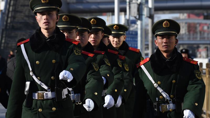 Paramilitary police officers  outside Beijing Railway Station after the arrival of North Korean leader Kim Jong-un. Photograph: Greg Baker/AFP/Getty Images