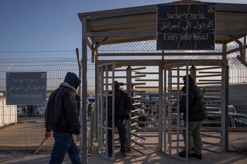 Palestinian workers enter Israel after crossing from Gaza on the Israeli side of Erez crossing between Israel and the Gaza Strip in March 2022. Photograph: Oded Balilty/AP